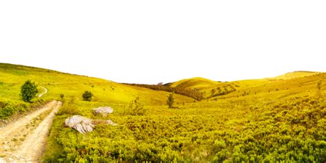 Sunset Over Mountain Panorama With Road Cutting Through Hillside Meadow