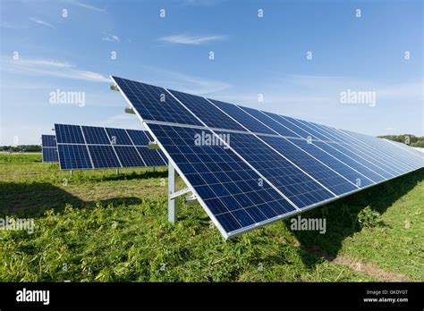 Close Up Of Blue Solar Panels With Blue Sky Hi Res Stock Photography