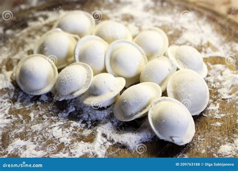 Traditional Pelmeni Or Dumpling At Cutting Board Homemade Preparation