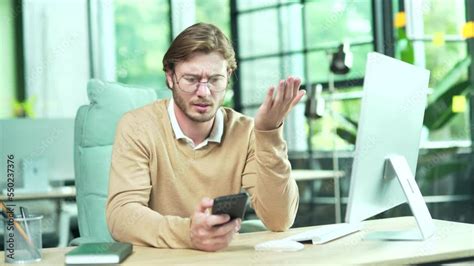 Annoyed Business Man Employee Having Problem With Smartphone At