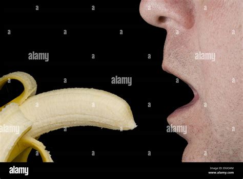 Eating a Banana Stock Photo - Alamy