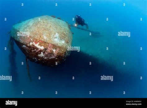 Divers at bow, shipwreck El Arish or El Arish El-Tor, sunken car ferry, Port Safaga, Red Sea ...