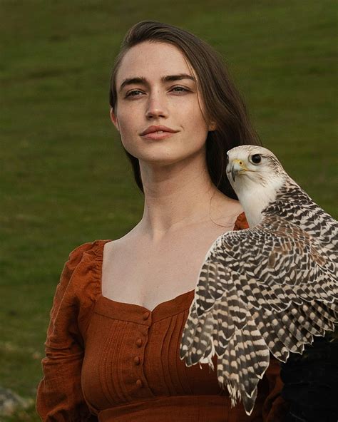 A Woman Holding A Bird Of Prey In Her Hand Photo Free Wales Image On Unsplash