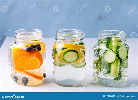 Glass Jars With Fresh Infused Water Made With Organic Fruits And