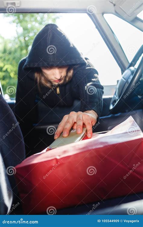 Burglar Thief Stealing Smartphone And Bag From Car Stock Image Image