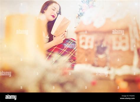 Peaceful Brunette Reading On The Couch With Cover Stock Photo Alamy