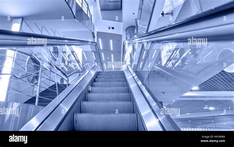 Perspective Of Escalator Toned In Blue Color Stock Photo Alamy