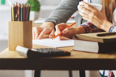 Premium Photo European Male And Female Doing Paperwork Closeup