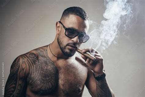 Portrait Of Handsome Man Smoking Cigar Tattooed Man With Cigar