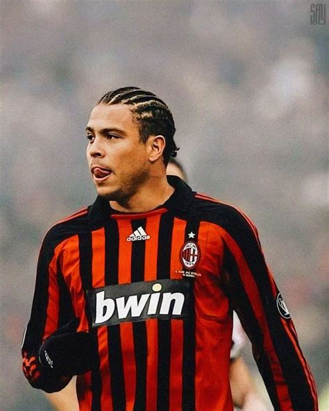 A Soccer Player With Dreadlocks On His Head Is Looking Away From The Camera