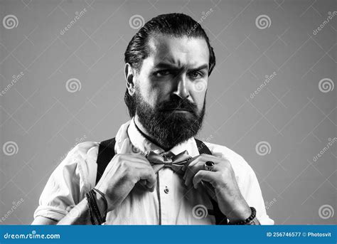 Brutal Bearded Man With Moustache Wear Suspenders And Bow Tie Retro