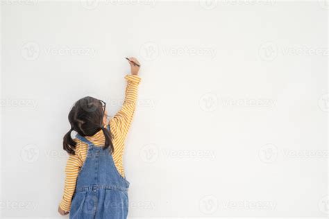 Little children painting on white wall 13066301 Stock Photo at Vecteezy