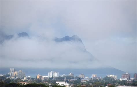 Strand Beach Road and a misty False Bay as seen from Main Road in
