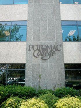 the sign on the building says poldamac college in front of some bushes and trees