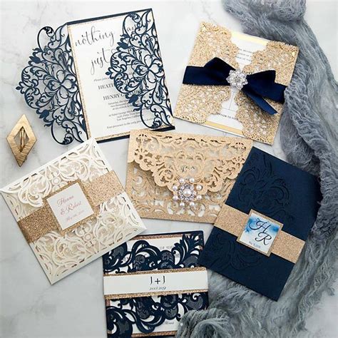 The Wedding Stationery Is Laid Out On A Marble Surface With Blue And