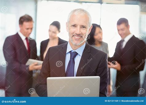 Portrait Of Businessman Using Laptop Stock Image Image Of