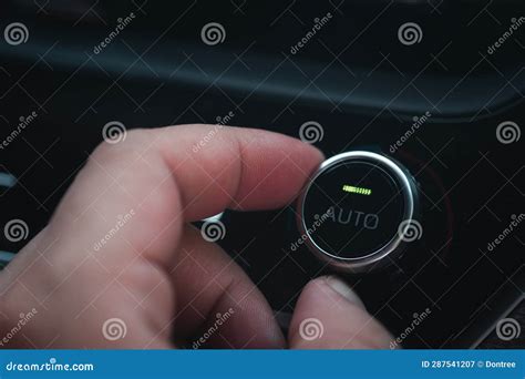 Hand Adjusting The Air Conditioner Button In The Car Stock Image