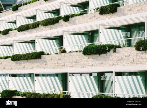 Background Of Balconies On Hotel Floors With Balcony Flowers And