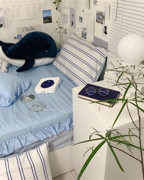 A Bed Room With A Neatly Made Bed And A Stuffed Whale