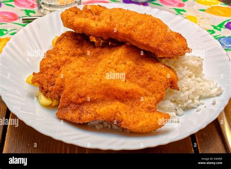 Two Crispy Baked Pork Cutlets On White Plate Stock Photo Alamy