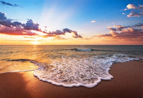 Colorful Ocean Beach Sunrise With Deep Blue Sky Stock Image Image Of