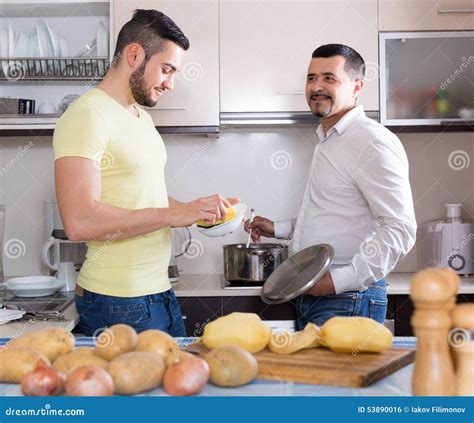 Two Men Cooking At Home Stock Photo Image Of Couple 53890016