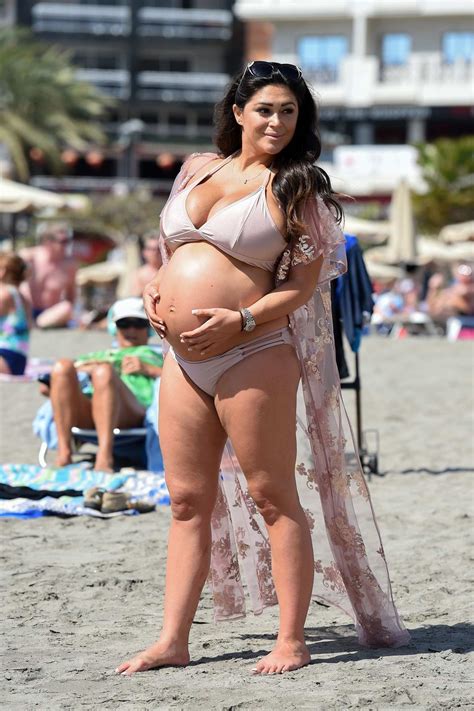 Casey Batchelor Shows Off Her Baby Bump In A Pastel Pink Bikini While