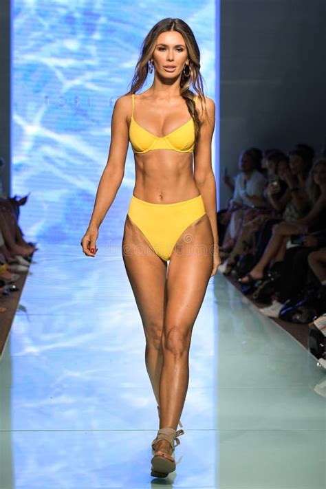 A Model Walks The Runway During The Tori Praver Swimwear Runway