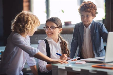 Three Cute Kids Working on Lessons Together Stock Photo - Image of ...