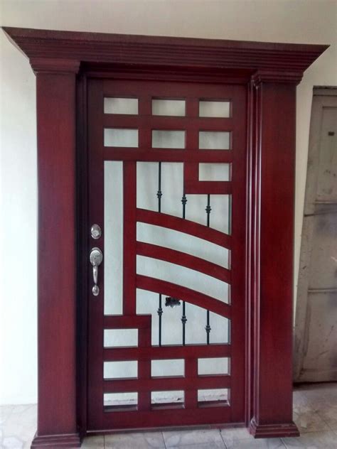 A Wooden Door With Glass Panels On It