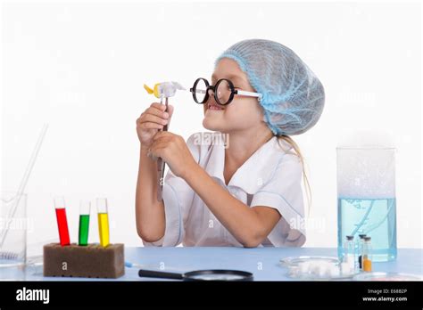 Chemist Girl Sitting At The Table With The Reagents In Chemistry Class