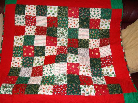 Easy Christmas Quilt Made From Squares Of Different Christmas Materials