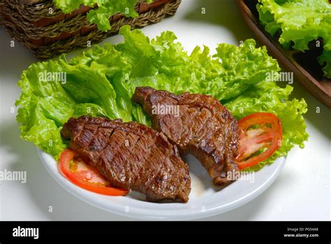 Sliced Picanha With Tomato Salad And Lettuce Stock Photo Alamy