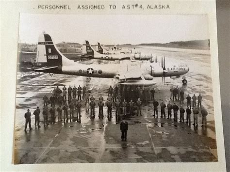 an old black and white photo of people standing in front of airplanes ...