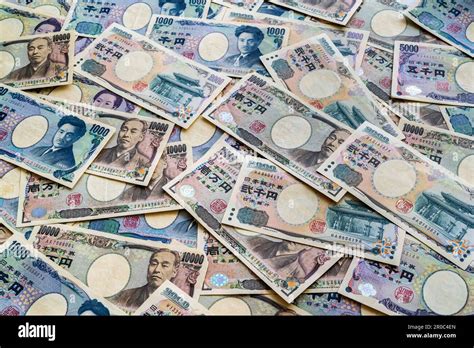 Japanese Currency View Looking Down At A Pile Of Japanese Banknotes In