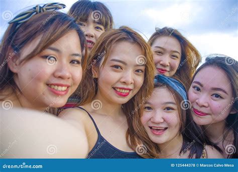 Lifestyle Beach Portrait Of Asian Korean And Chinese Women Group Of