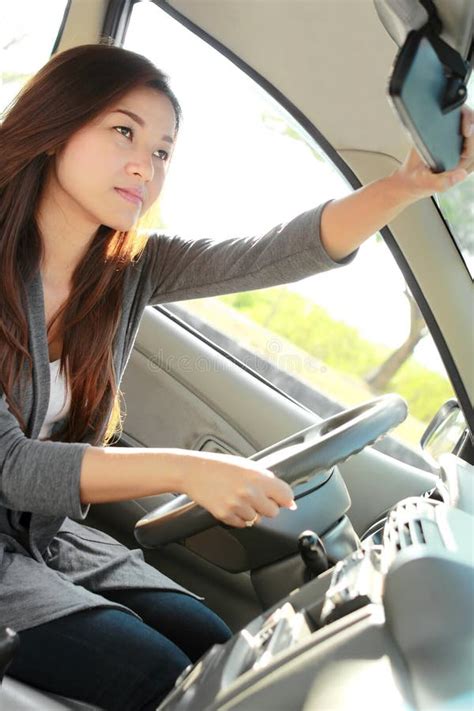 A Woman Adjusting The Rearview Mirror Stock Image Image Of Trip Long