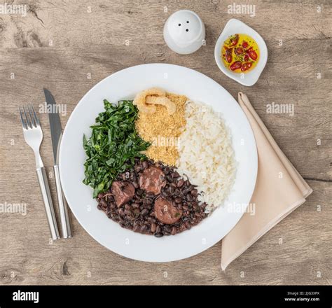 Typical Brazilian Feijoada With Rice Pepper Farofa Kale And