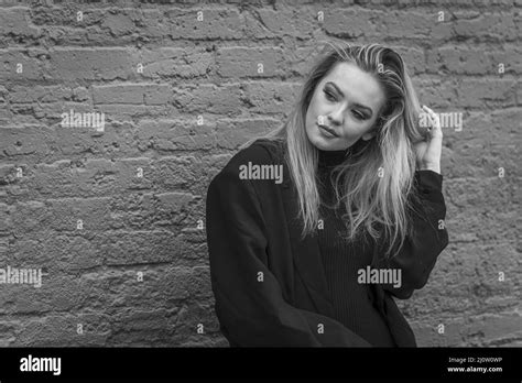A Lovely Blonde Model Poses Outdoor While Enjoying The Fall Weather Stock Photo Alamy