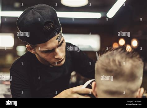 Crop Barber Doing Haircut For Client Stock Photo Alamy