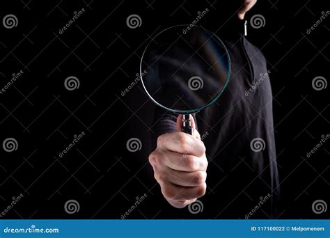 Man`s Hand Holding Classic Styled Magnifying Glass Stock Photo Image