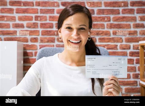 Boss Holding Payroll Bank Check Salary Paycheck Stock Photo Alamy