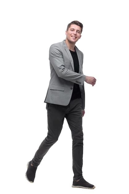 Premium Photo | Serious young man goes forward isolated on white