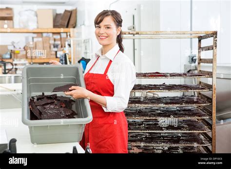 Worker Holding Beef Jerky And Basket At Butchers Shop Stock Photo Alamy