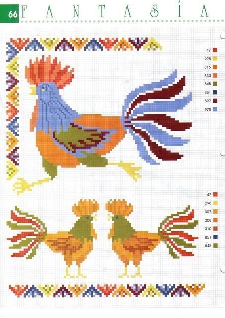 A Cross Stitch Pattern With Two Roosters On Each Side And The Words