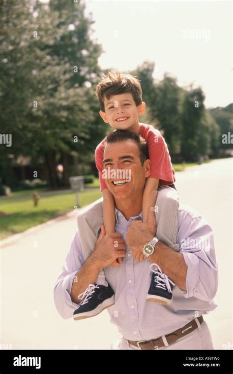 Father Carrying His Son On His Shoulders Stock Photo Alamy