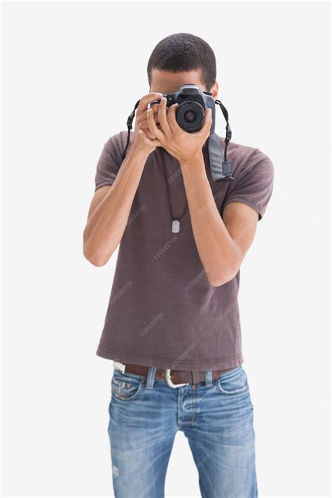 Premium Photo | Hip young man pointing his camera at the camera