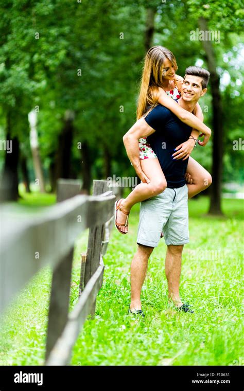 Happy Couple In Love Having Fun Outdoors And Smiling Stock Photo Alamy