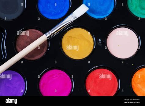 Set Of Watercolor Paints And A Paintbrush Stock Photo Alamy