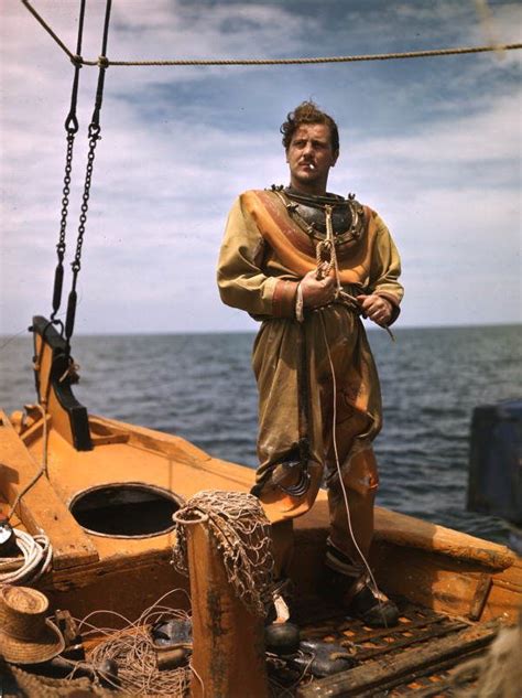 A Sponge Diver Puts On His Suit In Tarpon Springs S Florida